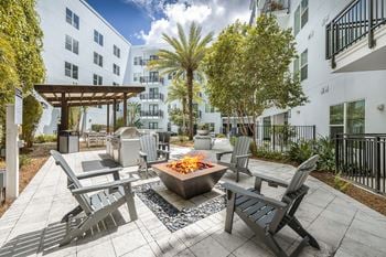 Courtyard grills with fire pit elements
